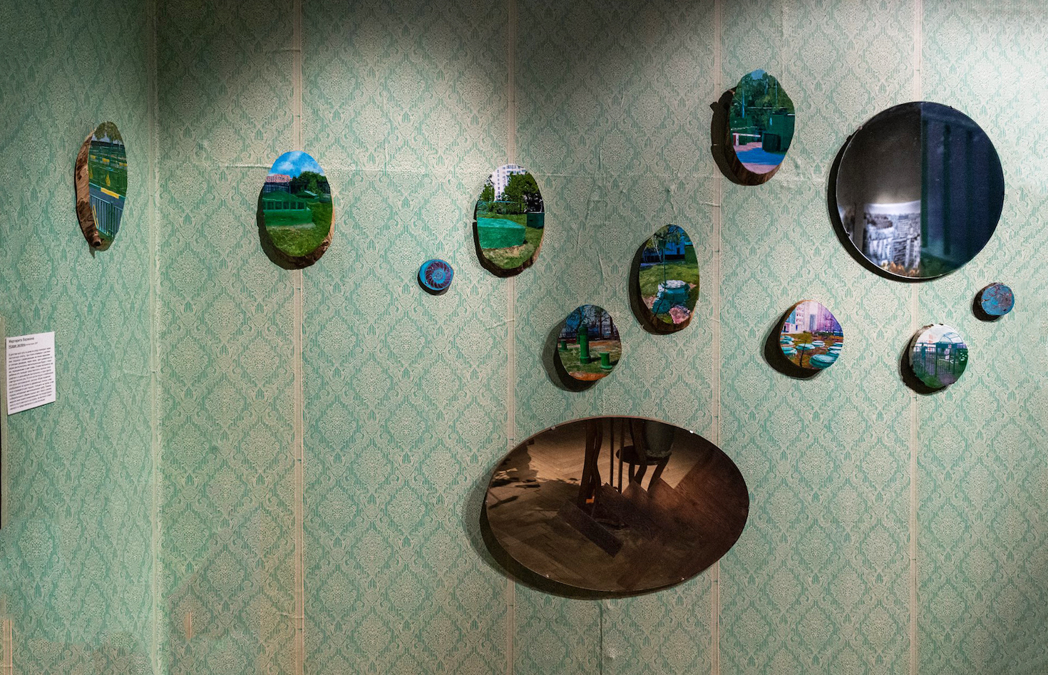 The New Greenery series, 2019. This project subverts a traditional decoration—painting on cut wood logs—by replacing the usual landscapes with post-industrial (sub)urban scenes