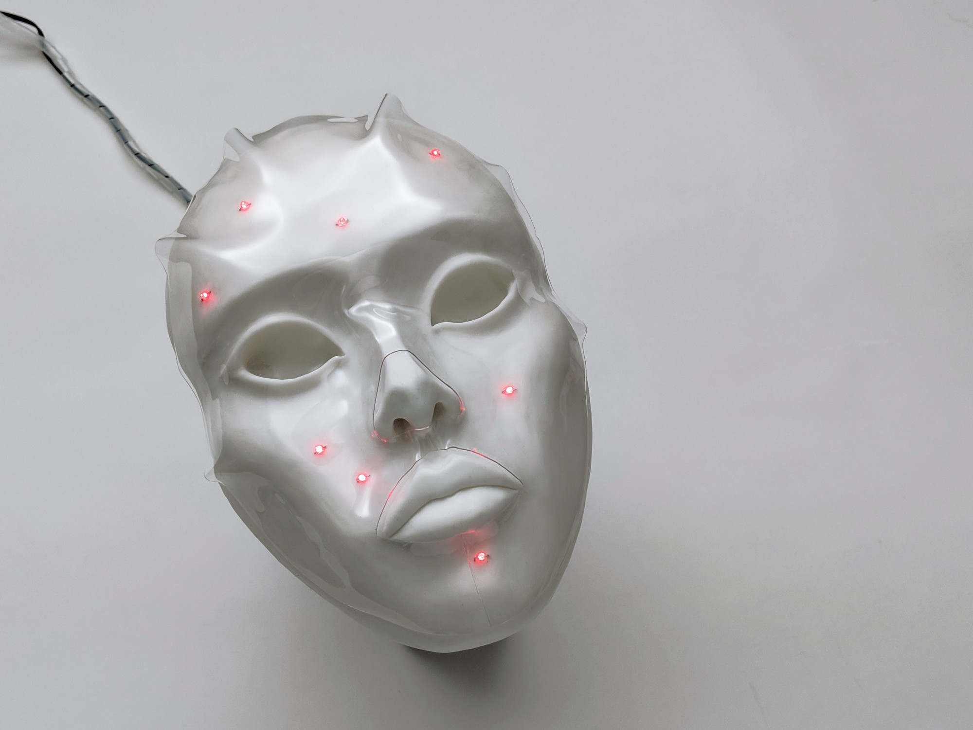 Red Pixel, 2018. Electronic mask imitating blemishes on one’s facial skin