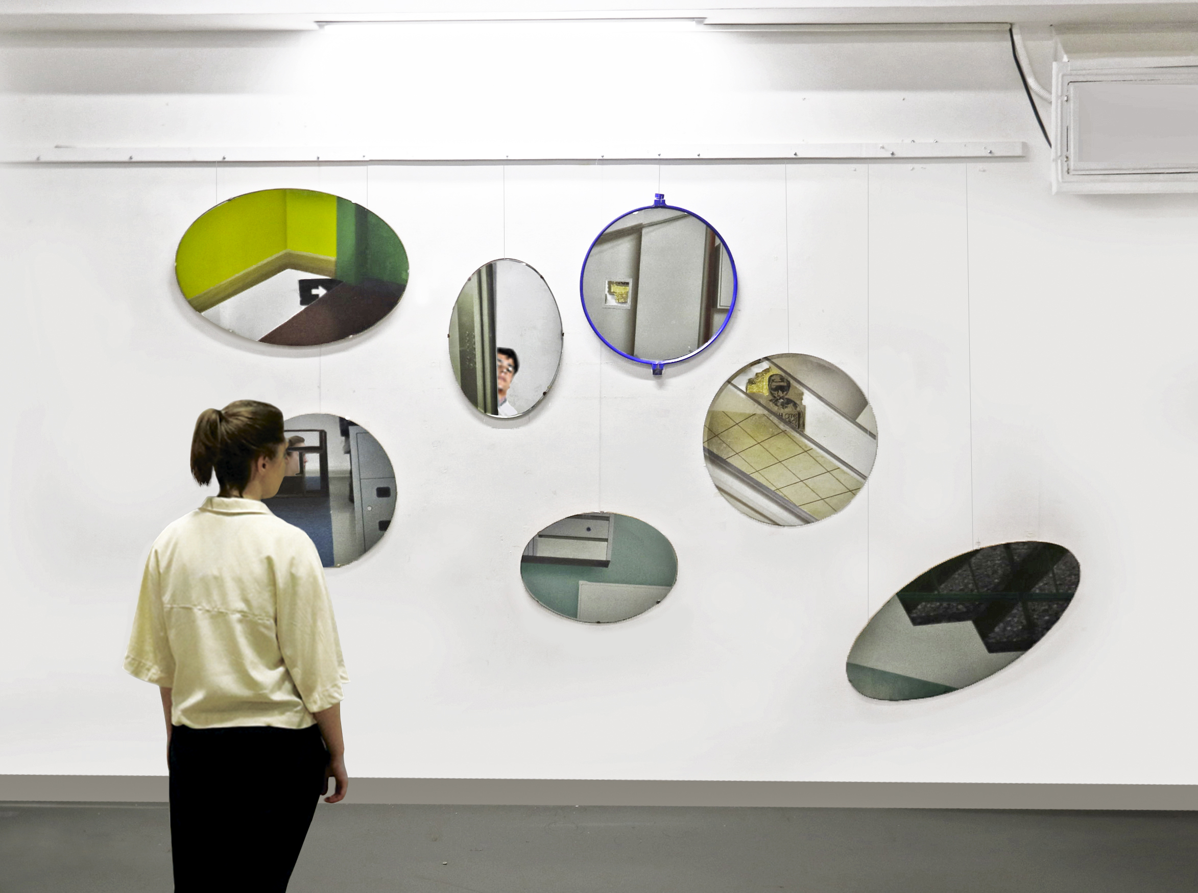 Through the Looking Glass and Back, 2019. Uncovered mirrors reflect the viewer, putting them into these spaces