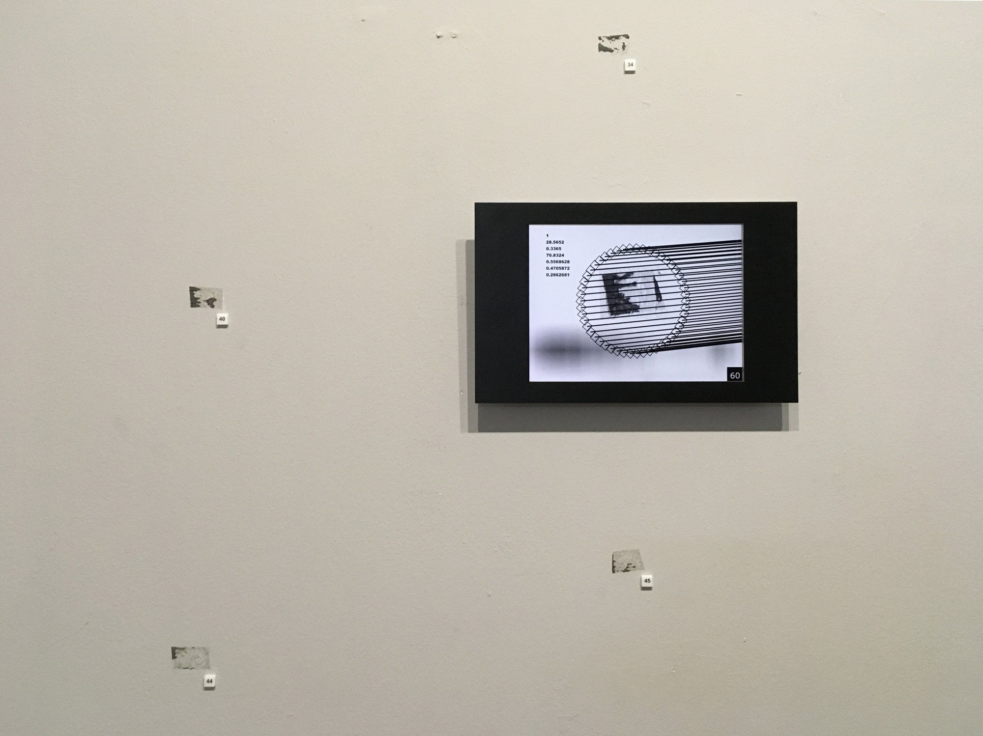 Fragment of the Tape Marks installation, 2o19. Impulse exhibition, Kuryokhin Centre, St Petersburg. An algorithm gathers information from tape marks that remained from a previous exhibition