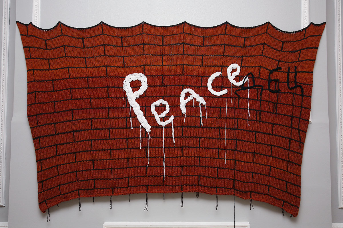 Fish Are Mute, 2015. Here, Bojko adds three letters to the word “peace,” making it sound like “f*cked up” in Russian