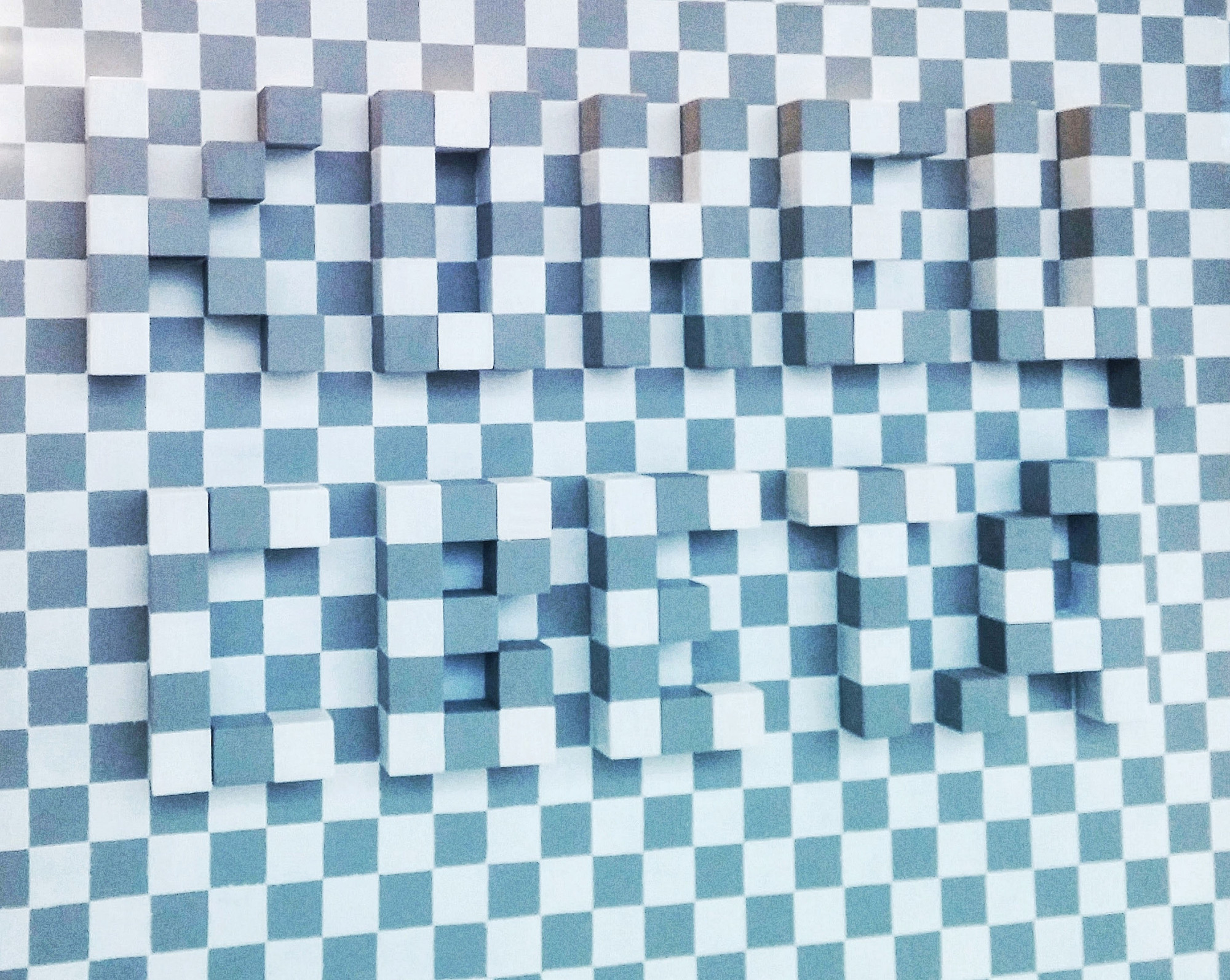 End of the World, 2015. The words “end of the world” become visible only if a light is placed to the side of the work