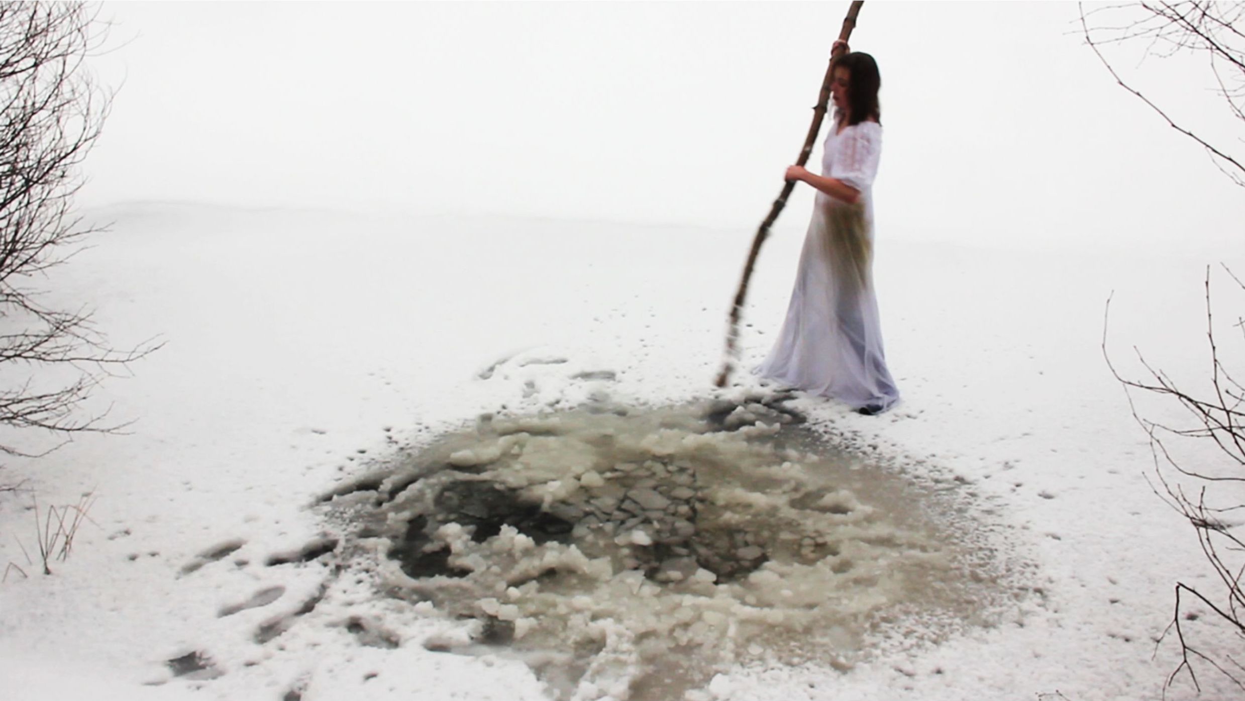 Ice, 2012. The Russian expression “to be flopping like a fish on the ice” means to struggle desperately. Here, a young woman in a white dress, a symbol of unwanted femininity, is trying to break the ice just as desperately