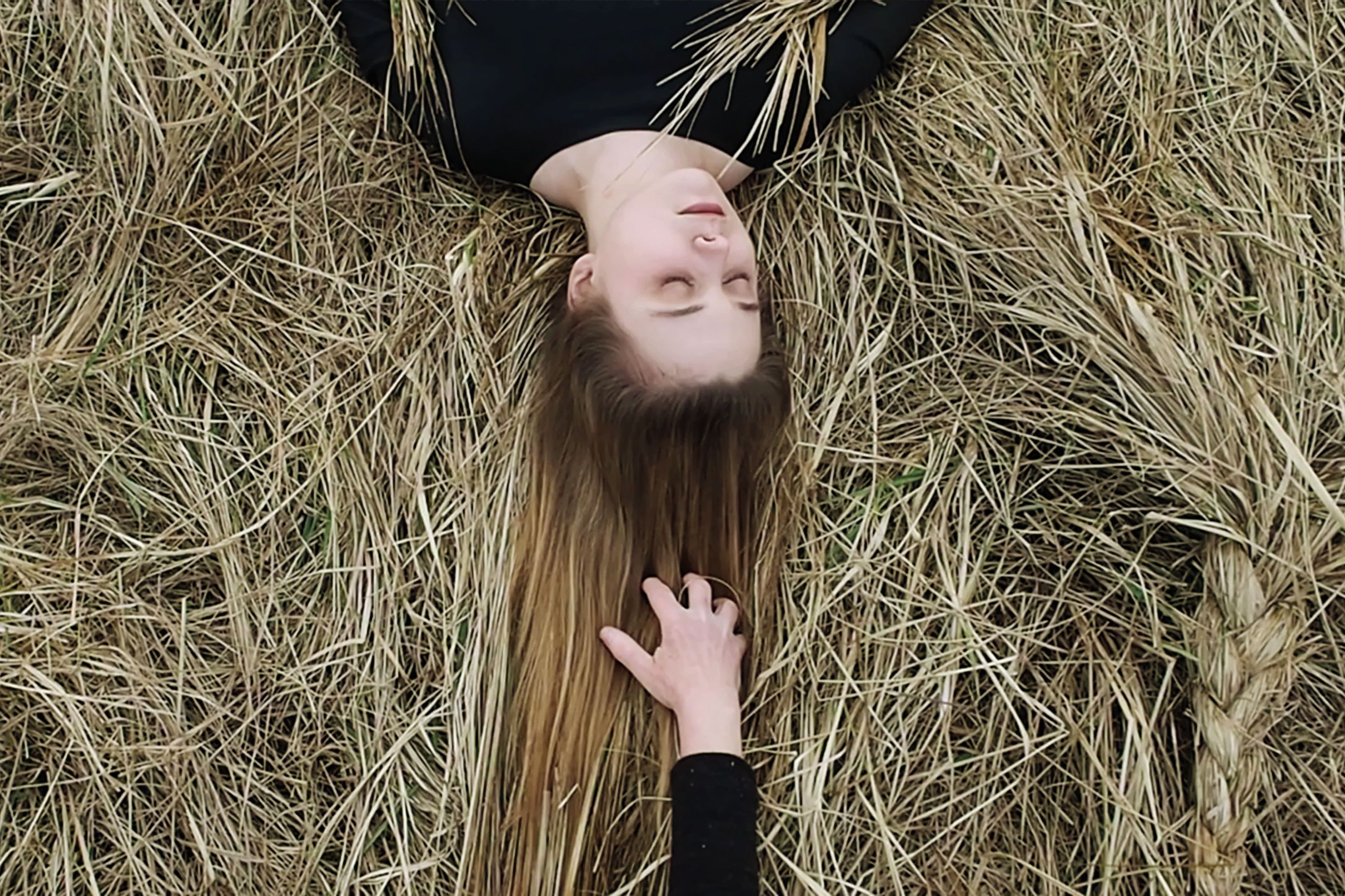 Still from Art of Braiding, 2018. Playing on a Russian word “kosa,” which can refer to a braid, a scythe, or a spit of land, the Gentle Women explore the deep symbolic meaning of women’s hair