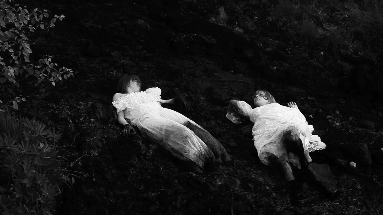 Dirt, 2010. These young women wore black dresses as their wedding gowns. In this performance, the duo imagines the ritual of bidding farewell to the home and the native soil before leaving and getting married