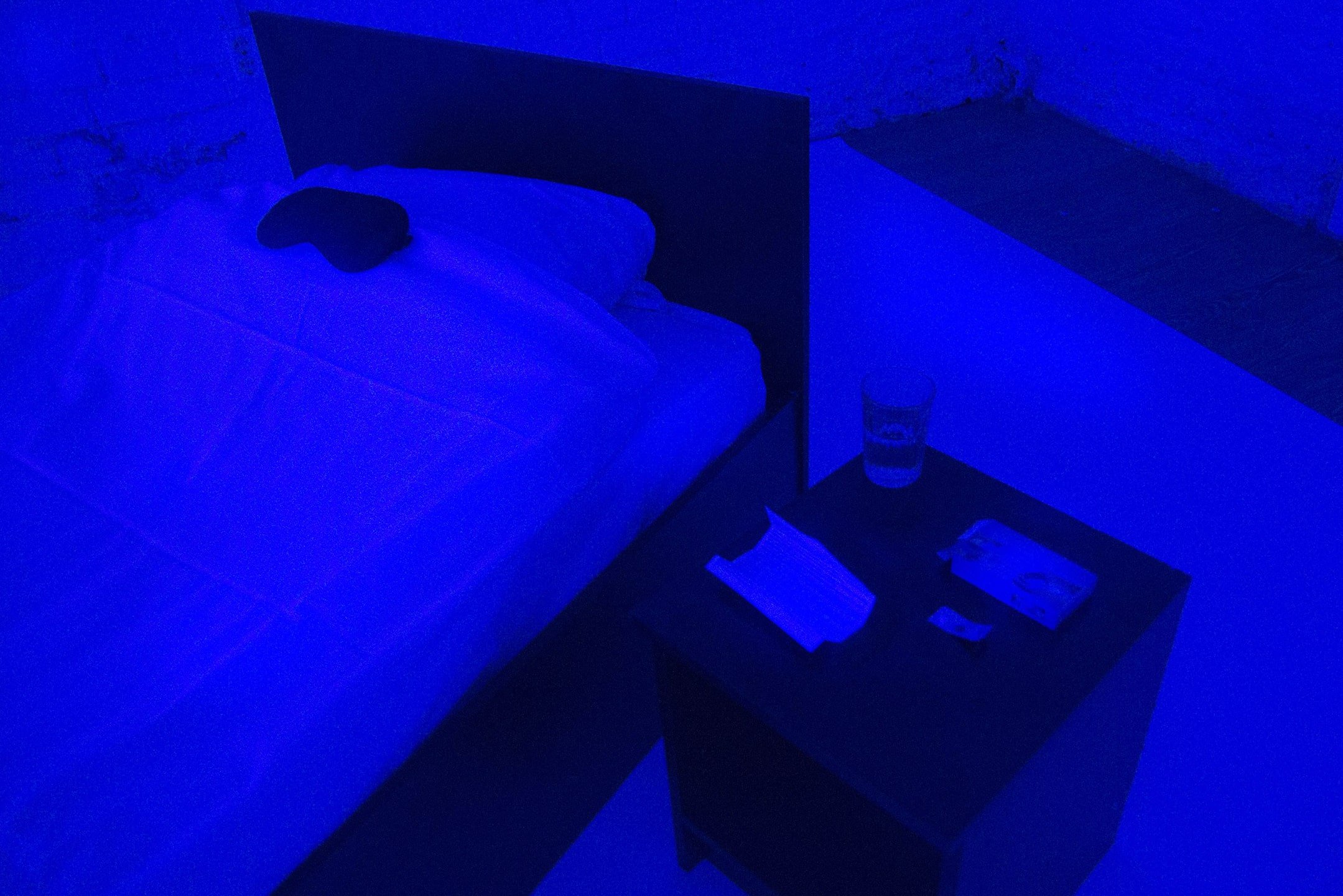 Iceberg-18010813. Blue Room, constructed situation, 2018. Visitors, who saw the invitation at the Russian equivalent of Gumtree, entered a basement room alone, where they found a bed, a sleeping pill, and a laptop with access to Dark Web