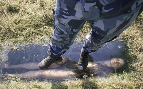 Untitled, 2013. Archstoyanie Festival of Landscape Objects, Kaluga Region. Here, Kroytor reflected on the relationship between the artist and the work by putting her own body behind glass, where her work could be