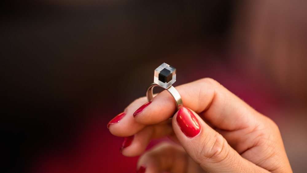 A smog free ring, with a black stone made from compressed pollution. Image: Studio Roosegaarde