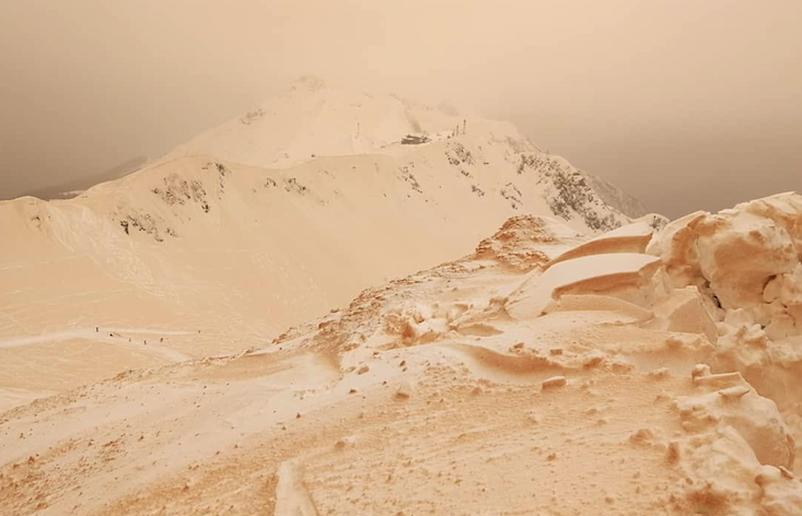 Orange snow transforms snowscapes into alien worlds across the New East