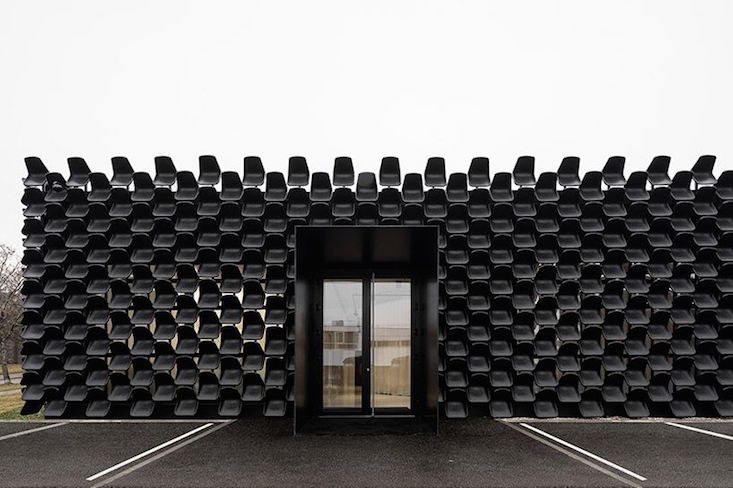 Czech architects create facade from 900 plastic chairs